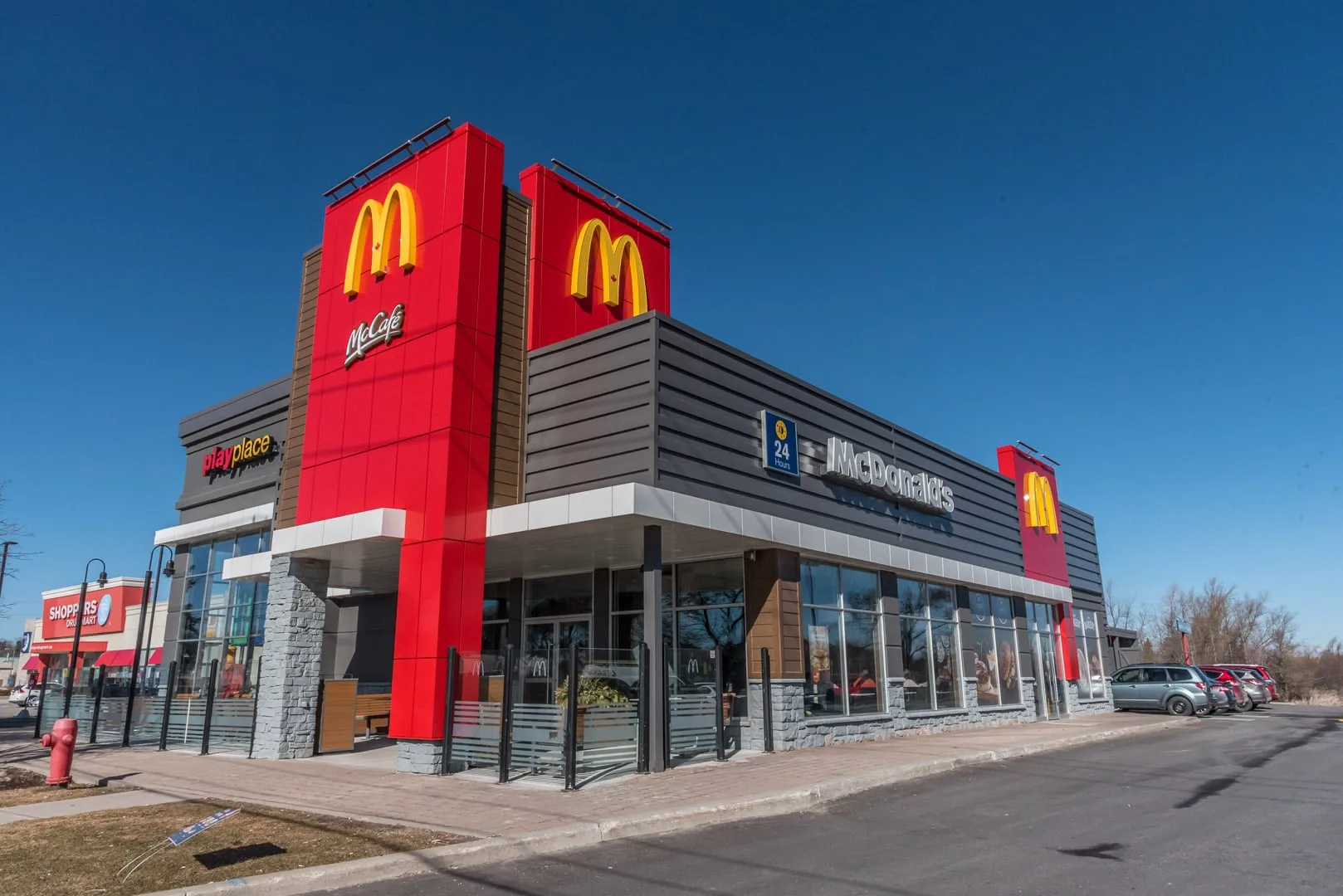 Retrofitted LED parking-lot pole light outside a McDonald's