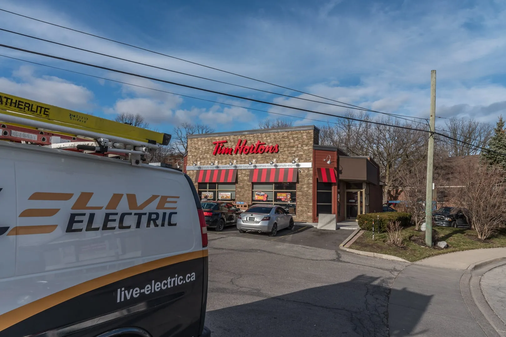 Renovated Tim Hortons in Dundas with a Live Electric van in the foreground